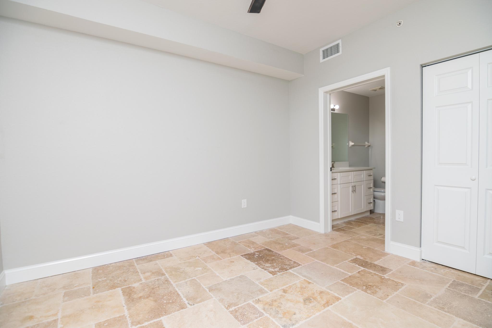 The main bedroom of the condo is located in the back of the unit and faces the preserve.