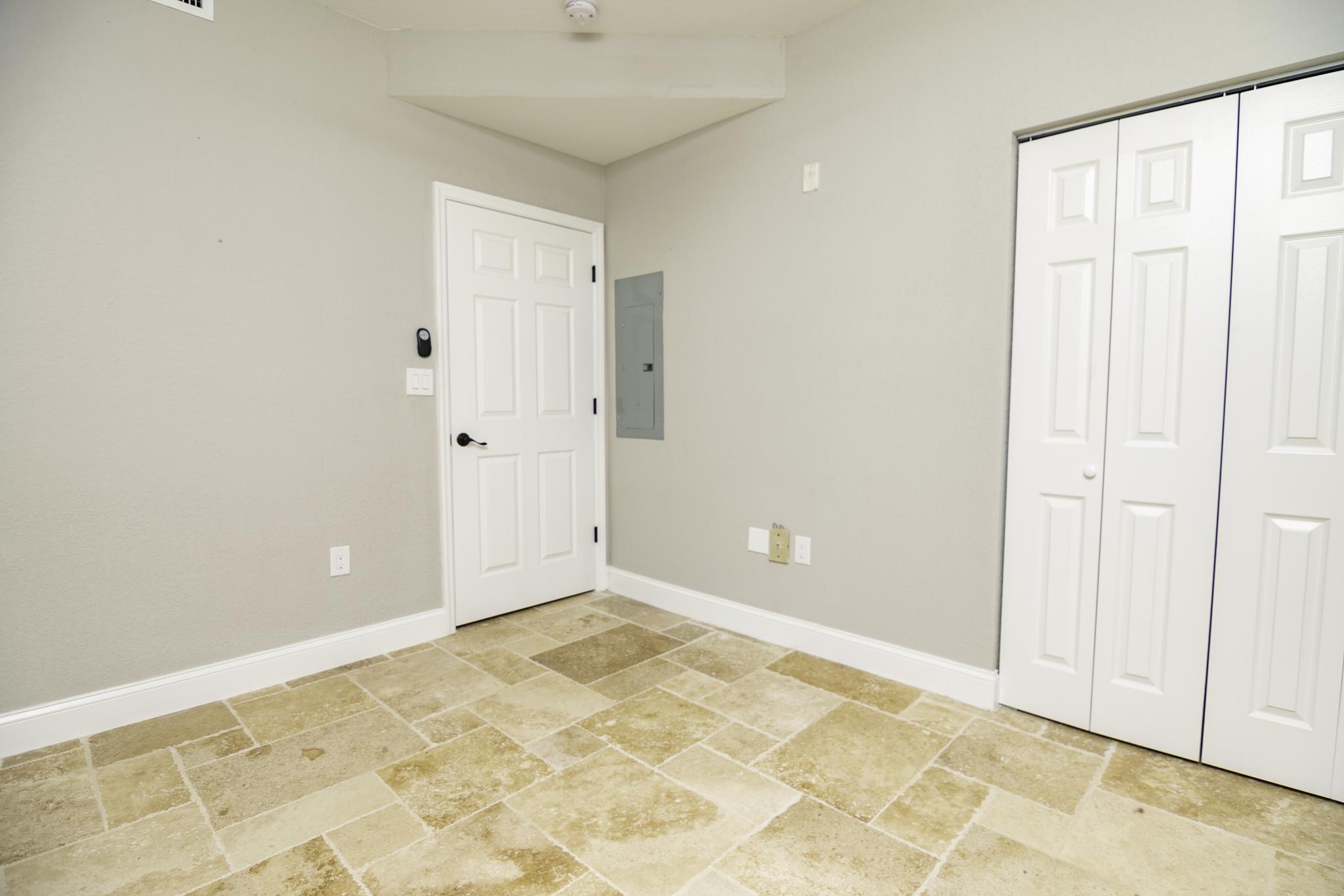 The second bedroom is located in the front of the condo and has a large closet.
