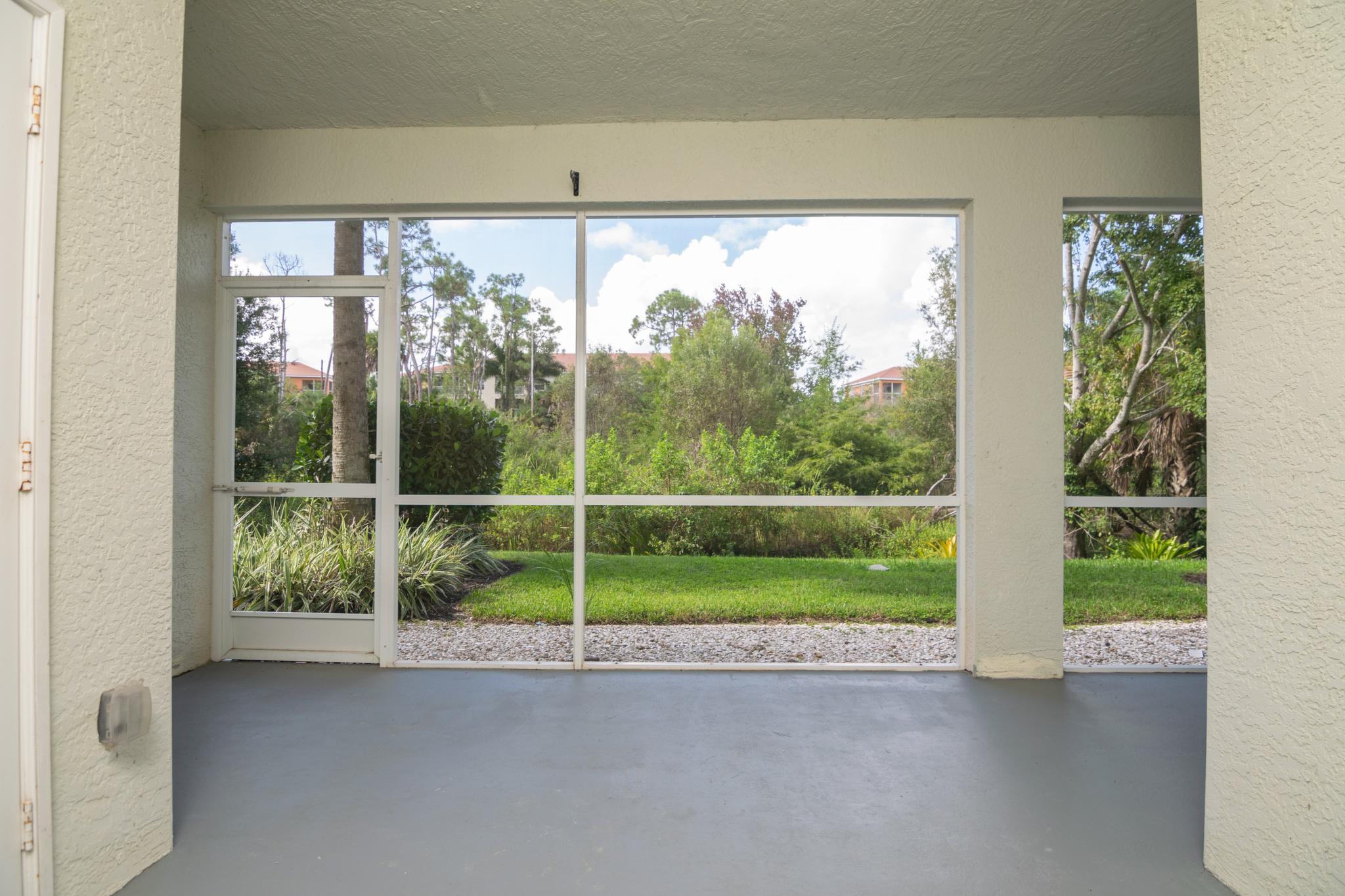 The Lanai Is Large, Covered and Screened and Includes the Laundry Closet to the Left